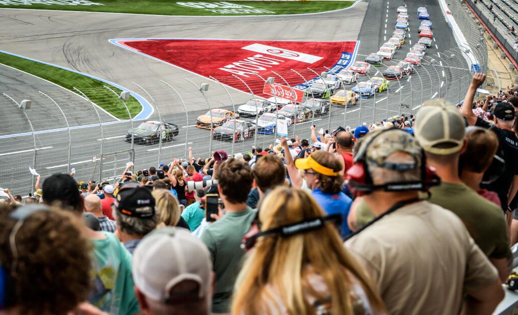 a crowd watching a nascar race