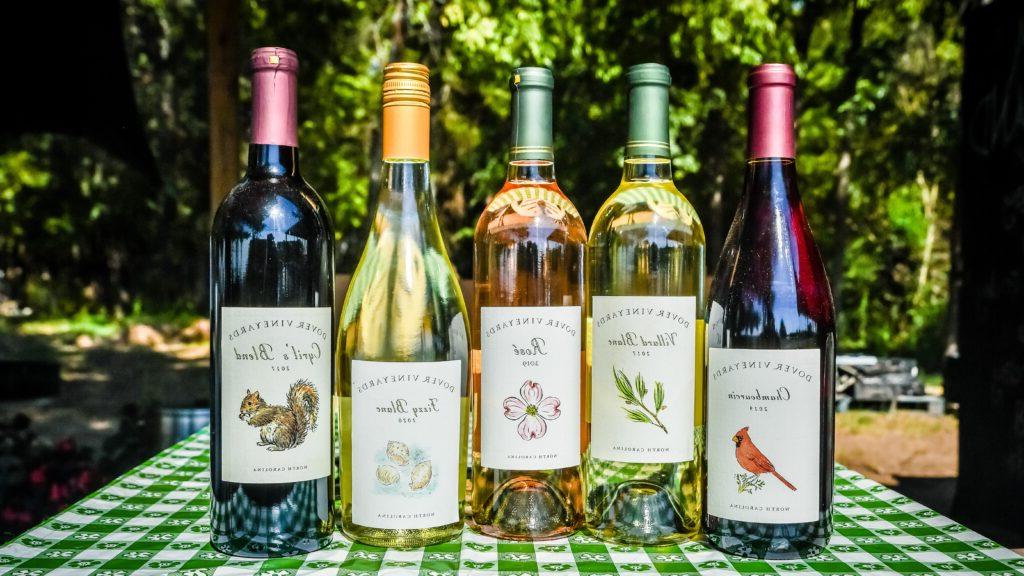 wine bottles lined up on table